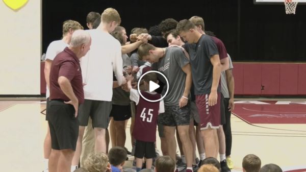 the knights form a huddle together around walsh