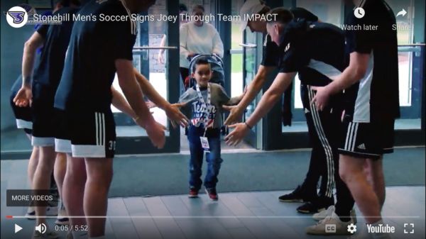Joey gives high fives to her new teammates