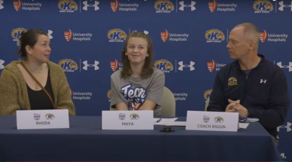 Maya seated at her signing day